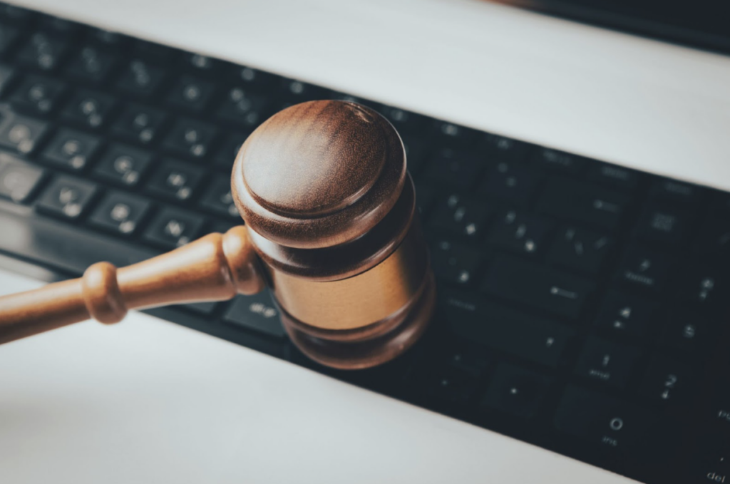 Computer keyboard next to a legal gavel